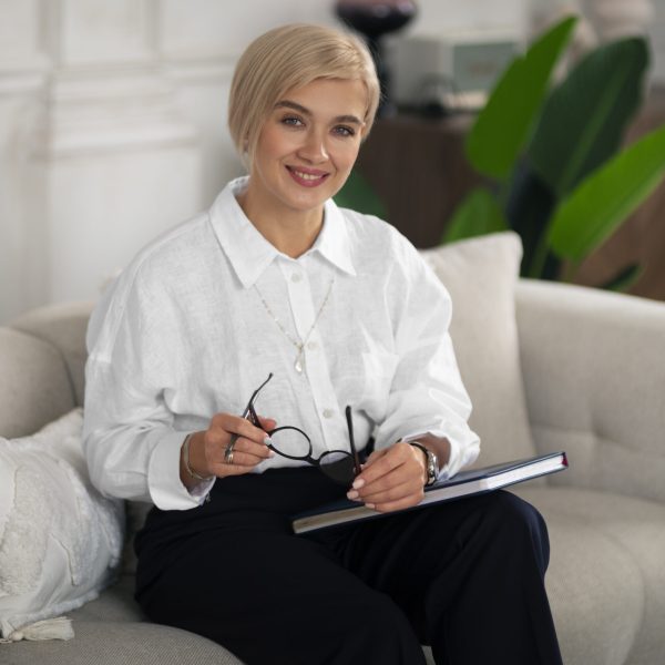 front-view-woman-sitting-couch